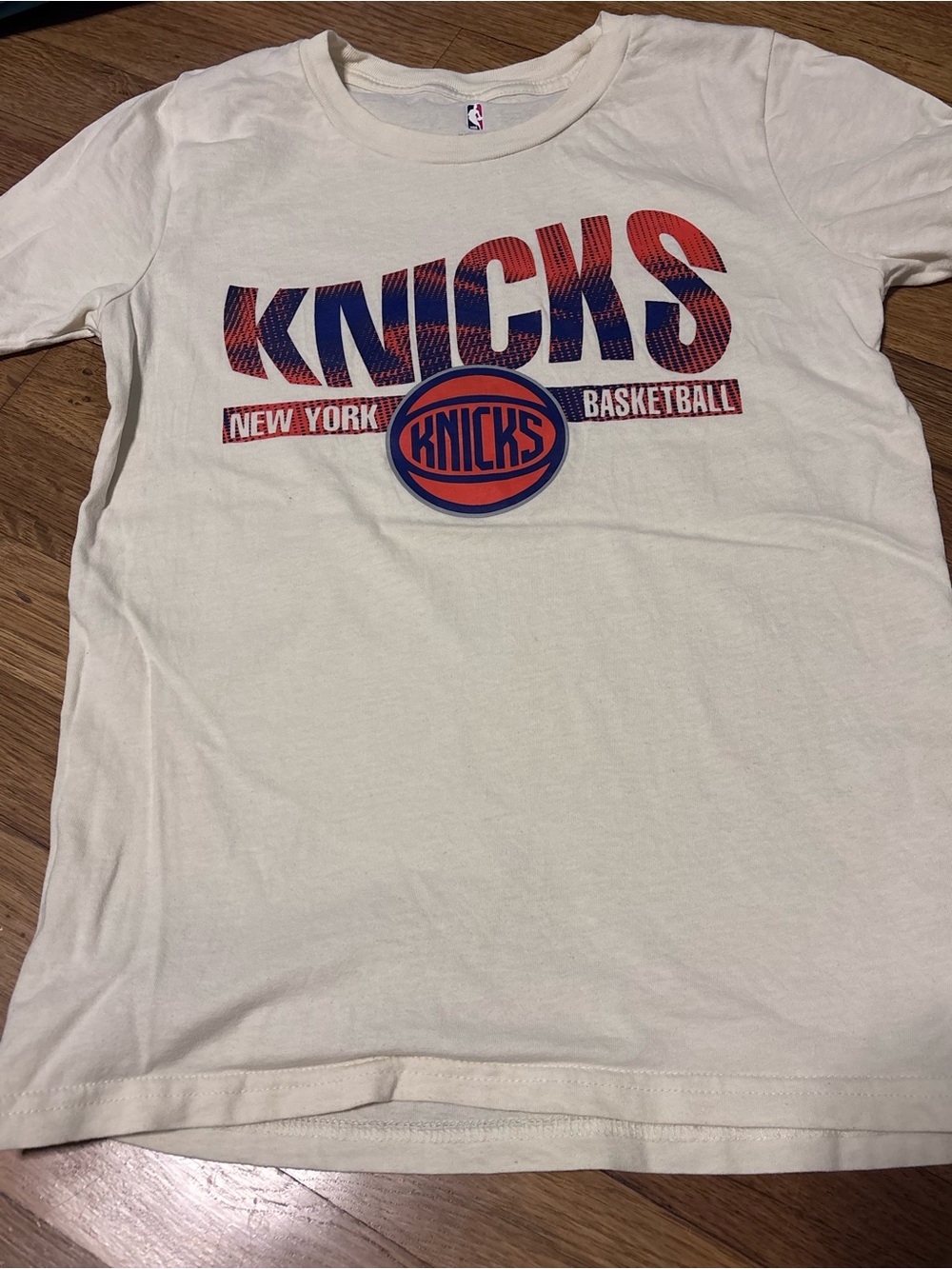 NBA Kids Cream Short Sleeve Tee with Orange & Blue Knicks Logo
